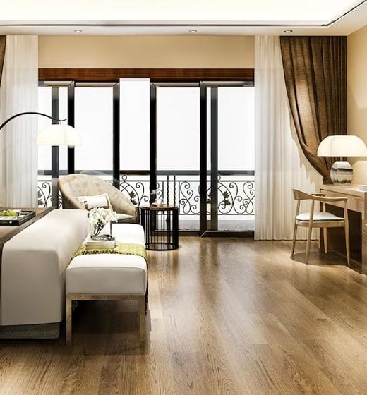 Conceptual bedroom seating area beside full-height balcony doors. Not the actual project.