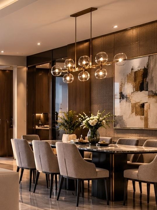 Conceptual dining area with a glass globe chandelier and upholstered chairs. Not the actual project.
