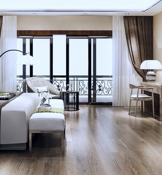 Conceptual bedroom seating beside full-height balcony doors. Not the actual project.
